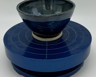 4 bowls thsat are deep blue wiht white flecks. 3" high by 4" wide.