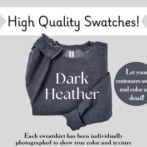 May include: A dark heather grey sweatshirt folded in half. The text "Dark Heather" is printed in white on the front of the sweatshirt. The image is a high quality swatch to show the true color and texture of the fabric.