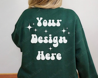 May include: A dark green sweatshirt with a white design that says "Your Design Here" in a retro font. The design also includes small white stars.