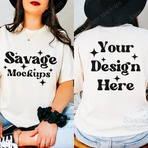 May include: A white t-shirt mockup with the text "Savage Mockups" on the front and "Your Design Here" on the back. The shirt is being modeled by a person wearing a black hat and blue jeans.