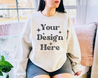 May include: A white sweatshirt with the text "Your Design Here" in a retro font with small stars on either side of the text.