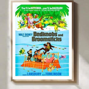 May include: A framed vintage movie poster for "Bedknobs and Broomsticks." The poster features colorful illustrations of characters and scenes from the film, with text that reads "You'll be WITCHED...you'll be DAZZLED!" and the names of the stars.
