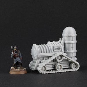 May include: A grey, detailed miniature model of a tracked vehicle with a large, cylindrical tank on the back. The vehicle has a series of small wheels on the tracks and a detailed engine compartment. The model is posed on a black surface.