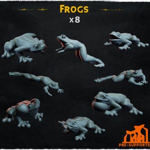May include: Eight 3D printed gray frog figurines in various poses. The frogs are posed in a jumping, sitting, and swimming position. The image text reads "FROGS x8".