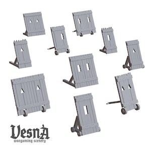 May include: A collection of grey wooden wargaming scenery pieces, including shields with various window and triangle cutouts. Some shields have wheels. The Vesna logo is visible at the bottom.