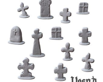 May include: A collection of twelve light gray miniature gravestones and crosses of various shapes and sizes, each featuring a textured base. The text Vesna wargaming scenery is printed in the bottom right corner in a black gothic font.