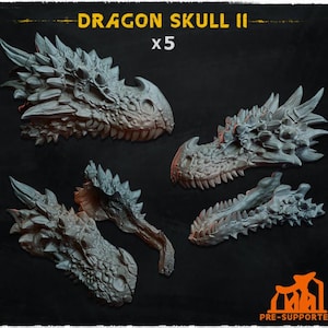 May include: Five gray dragon skull models with detailed textures and sharp teeth are displayed against a dark background. The text "DRAGON SKULL II" and "x5" are visible at the top. The bottom right corner has the text "PRE-SUPPORTED".