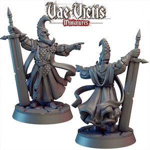 May include: Two gray plastic miniature figures of a person wearing a hooded robe and holding a sword. The figures are standing on a circular base.