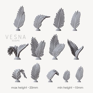 May include: A set of 12 miniature 3D printed fern sculptures in various poses. The ferns are gray and have a textured surface. The ferns range in height from 10mm to 20mm. The text "VESNA SCULPTS" is visible in the image.