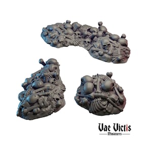 May include: Three piles of gray plastic bones and skulls, a tabletop gaming terrain piece.