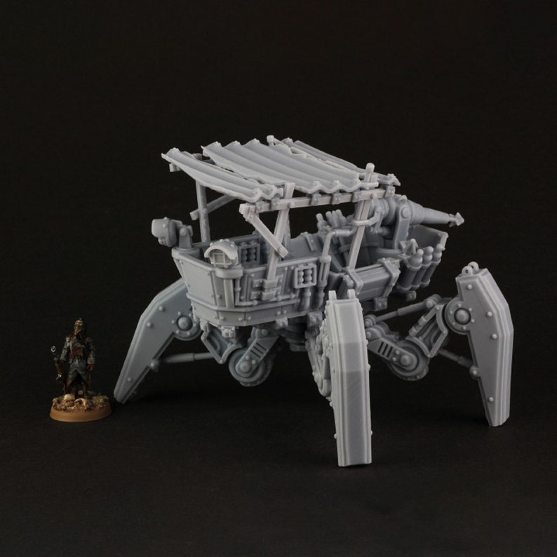 May include: A gray, 3D printed model of a steampunk-style walking ship with a wooden deck, a canvas awning, and four articulated legs. The ship has a cannon on the deck and a small figure standing on the ground in front of it.