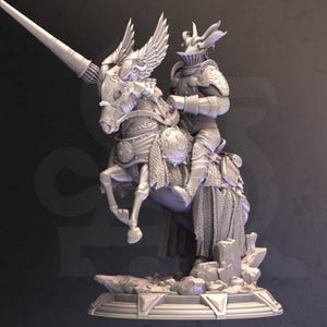May include: A detailed, gray, 3D printed miniature of a knight riding a winged horse. The knight is wearing armor and holding a lance. The horse is wearing armor and has wings. The miniature is on a base with a rocky texture.