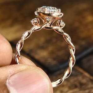 Pear Cut Moissanite Engagement Ring: 18K Rose Gold Halo, Twisted Pavé Band