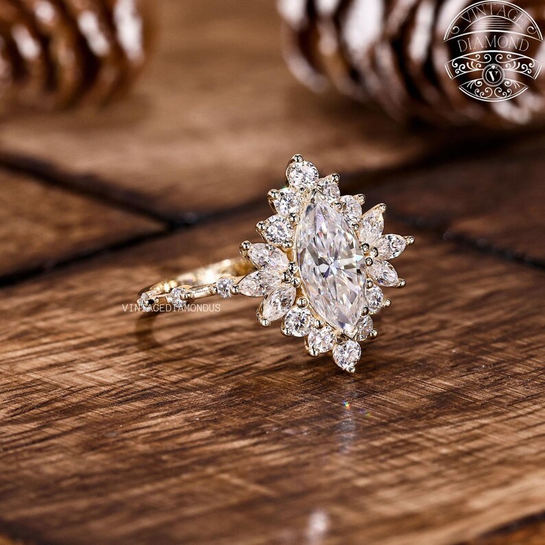 Elegant marquise halo engagement ring featuring a lab-grown diamond set inside a blooming floral halo. The center stone’s elongated shape enhances finger length while the halo adds fire and symmetry. Crafted in solid gold with VVS+ clarity diamonds, this sustainable ring is a perfect symbol of love.