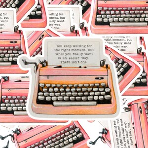 May include: A sticker featuring a vintage typewriter in shades of pink and orange. The typewriter has a paper with the text: "You keep waiting for the right moment, but what you really want is an easier way. There isn't one."