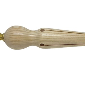 May include: A wooden ring mandrel with a brass tightening knob. The mandrel is designed to hold rings securely while working on them.