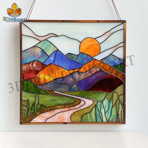 May include: A stained glass window depicting a colorful landscape with mountains, a winding road, and a setting sun. The mountains are a mix of blues, purples, oranges, and reds. The road is a light pink color and winds through a green valley. The sun is a bright orange and is setting behind the mountains.