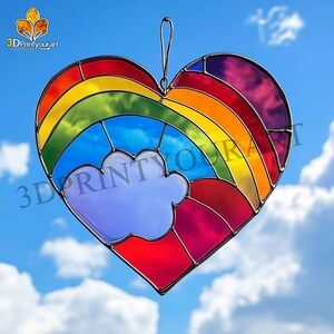 May include: A stained glass heart-shaped suncatcher with a rainbow and a cloud. The rainbow is made of red, orange, yellow, green, blue, indigo, and violet glass. The cloud is blue glass.