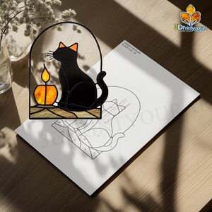 May include: A stained glass pattern for a black cat with a candle in a window. The pattern is printed on white paper with the title "3DPrintYourArt Black Cat - 14".