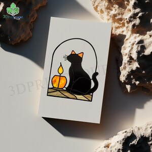 May include: A black cat sits in a stained glass window with a lit candle. The cat is looking to the left and the candle is in the lower left corner of the window.
