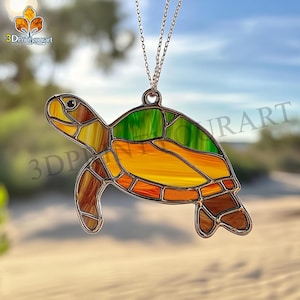 May include: A stained glass turtle pendant with a green, orange, and brown color scheme. The turtle is hanging from a silver chain.