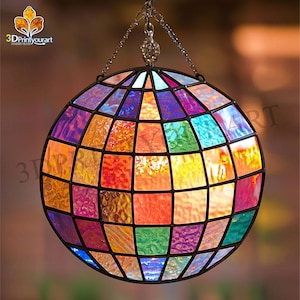 May include: A colourful stained glass globe pendant light with a black metal frame. The globe is made up of small squares of glass in various colours, including red, orange, yellow, green, blue, purple, and pink.