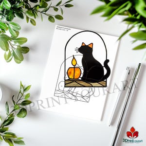 May include: A black cat sitting next to a lit candle in a stained glass window design. The design is printed on a white sheet of paper with the text "3DPRINTYOURART BLACK CAT - 18".
