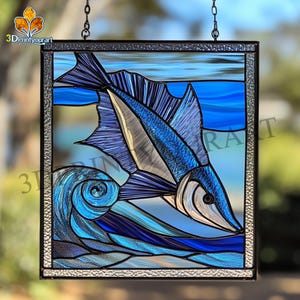 May include: A stained glass window depicting a blue marlin leaping out of the water. The marlin is surrounded by blue and white waves. The window is framed in black metal.