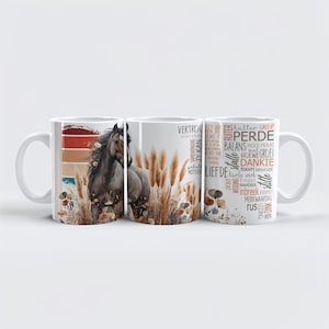 May include: Set of three white ceramic mugs. The center mug features a watercolor painting of a horse in a field of tall grass. The left mug has a sunset design. The right mug has words in a variety of fonts.