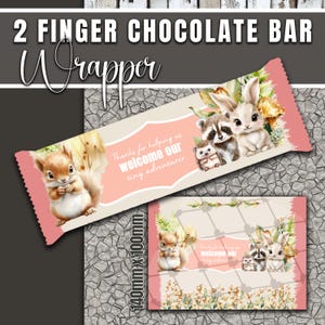 May include: A pink and cream-colored chocolate bar wrapper with the text "2 FINGER CHOCOLATE BAR Wrapper". The wrapper features illustrations of a squirrel, a raccoon, a bunny, and a hedgehog. The text "Thanks for helping us welcome our tiny adventurer" is also present.