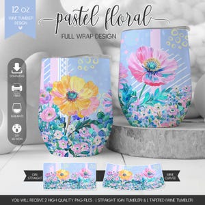 May include: Two 12 oz wine tumblers featuring a pastel floral full wrap design with painted yellow and pink flowers on a light blue background. The image includes text labels for download, print, sublimate, gin straight, and wine curved.