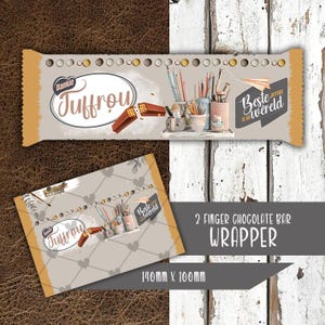May include: A chocolate bar wrapper with the text "Juffrou" in a decorative font. The wrapper features illustrations of pencils, paintbrushes, and a paper airplane. The dimensions are 140mm x 100mm.