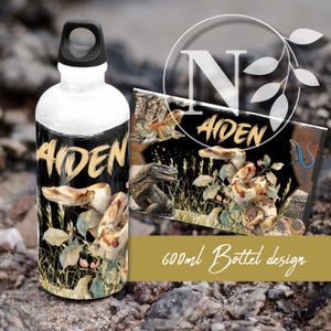 May include: White water bottle with a black cap and a wrap-around design featuring reptiles, the name "ADEN" in gold, and the text "600ml Bottle design". The design includes snakes, lizards, and other reptiles.