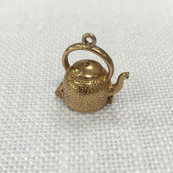 Articulated Gold Kettle with Fish Charm Pendant - image 1