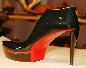 High heels in red made from an old shoe last