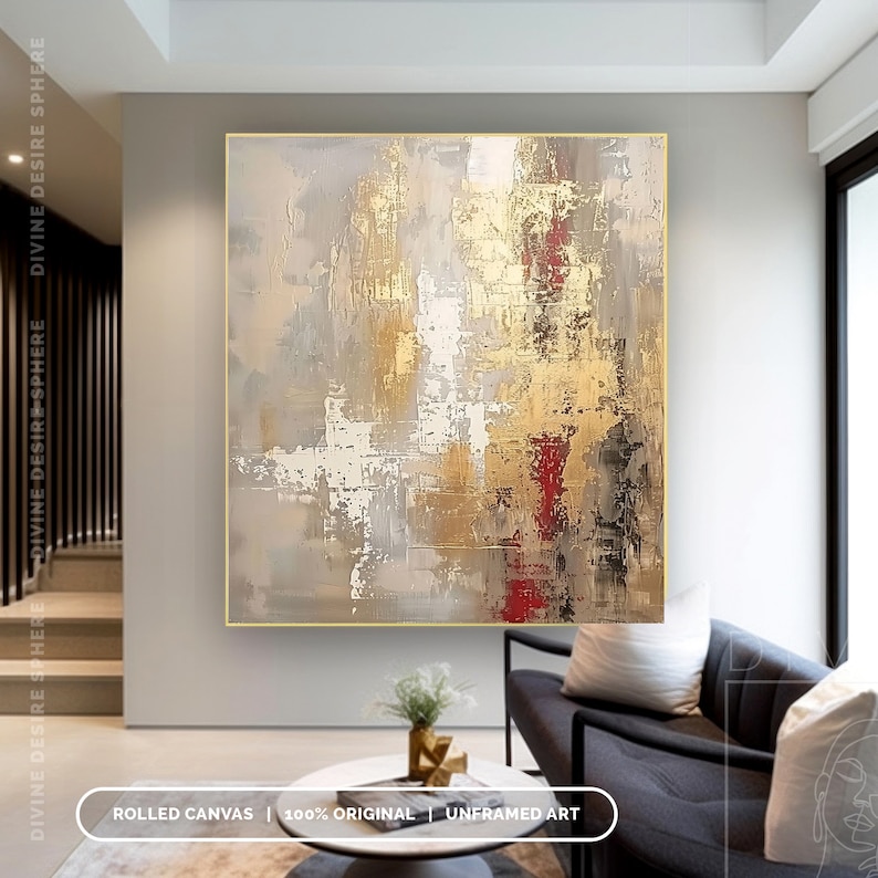 a living room with a couch and a painting on the wall