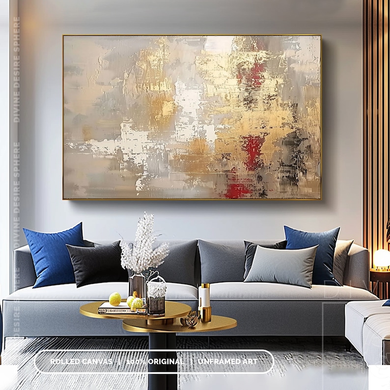 a living room filled with furniture and a painting on the wall