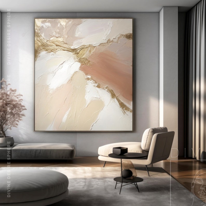 Elegant abstract artwork with gold vein-like textures flowing across soft beige and blush-toned background.