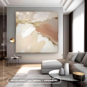 May include: Abstract art piece with a gold frame. The artwork features a textured design with shades of white, beige, and peach, accented with gold leaf. The text at the bottom reads "ROLLED CANVAS | 100% ORIGINAL | UNFRAMED ART."