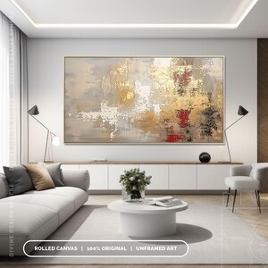 a living room with a large painting on the wall
