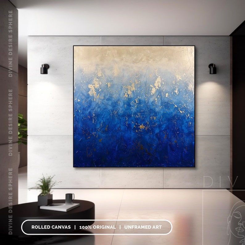 a large blue and gold painting hanging on a wall