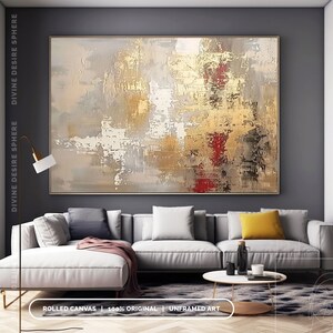 a living room with a large painting on the wall