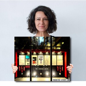 May include: A framed print of a fire command centre, featuring red and black accents, emergency equipment, and the text "FIRE COMMAND CENTRE." The print measures 16x20 inches (41x51 cm).