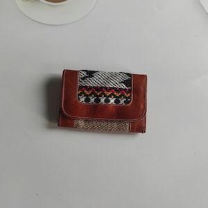 Women&#39;s handcrafted leather wallet with traditional texture