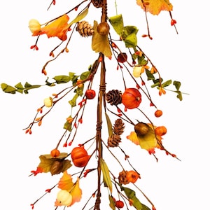 May include: A fall garland with brown branches, orange and white pumpkins, pine cones, acorns, and red berries.