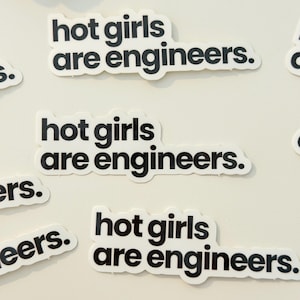 May include: Multiple white die-cut stickers featuring the black text "hot girls are engineers." in a sans-serif font. The stickers are arranged in a scattered pattern, each displaying the same phrase in lowercase letters with a period at the end.
