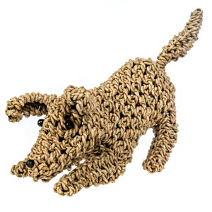 May include: A brown woven rope dog toy. The dog is in a running pose with its tail curled up. The dog has black eyes and a brown nose.