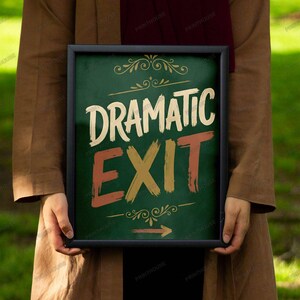 May include: A framed sign with the words "DRAMATIC EXIT" in white, gold, and red lettering. The sign has a dark green background and decorative flourishes. An arrow points to the right. The sign is held by a person wearing a brown coat.