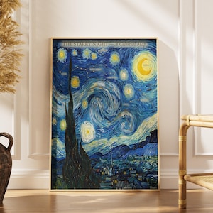 May include: A framed print of Van Gogh's "The Starry Night - A Celestial Map." The artwork features swirling blue and yellow brushstrokes depicting a night sky with stars and a crescent moon. The print is in a wooden frame and leans against a white wall.