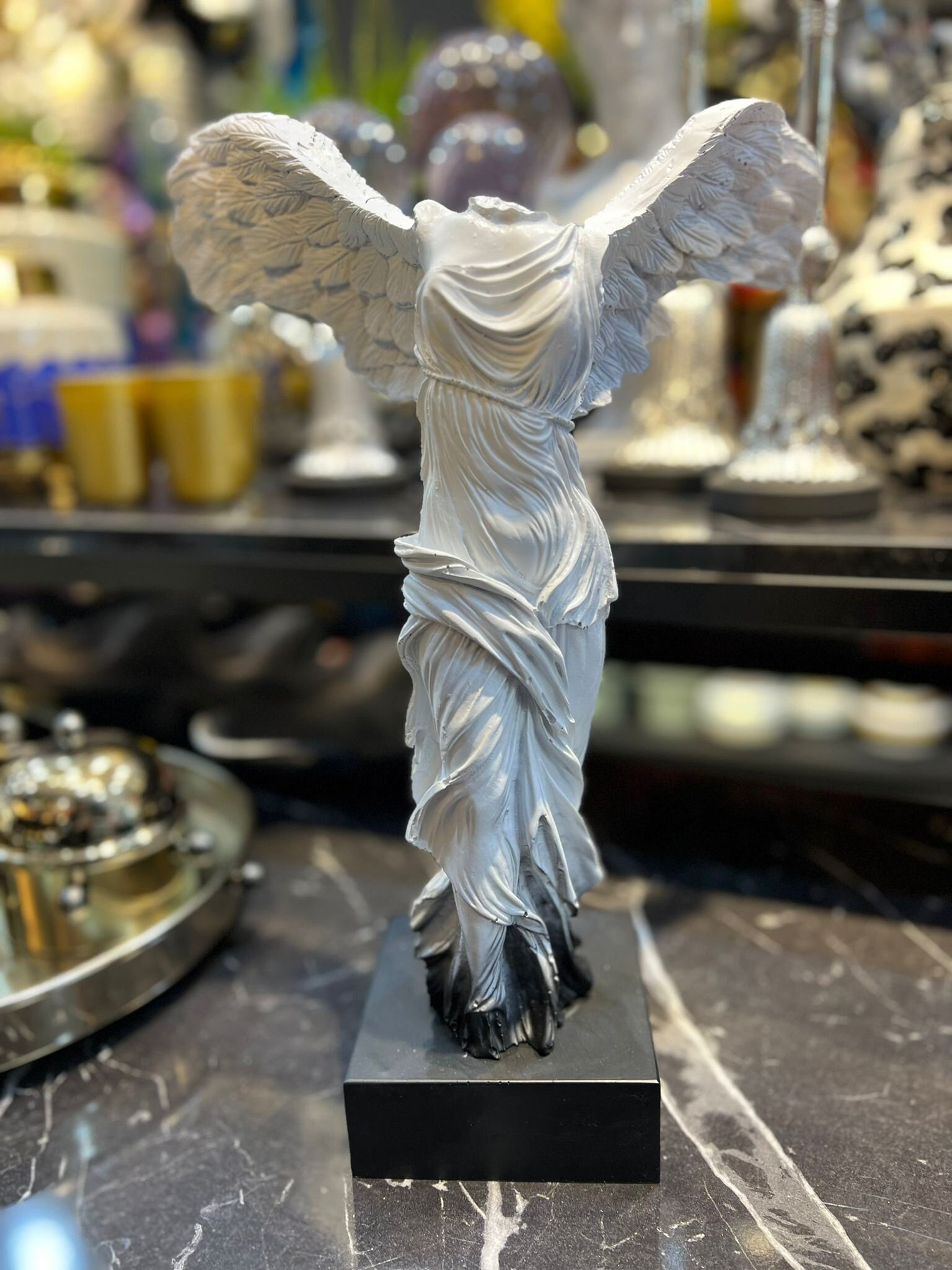 headless winged statue louvre